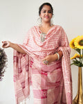 Beige Katan silk unstitched suit set block printed with panels of Sanskrit calligraphy in deep magenta, separated by linear stripes with white accents and straight, clean edges.