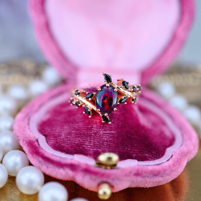 Black Fire Opal & Onyx Leaf Ring in 14K Rose Gold Vermeil featuring a marquise-shaped black fire opal surrounded by black onyx stones set in a delicate rose gold vermeil band, presented by Aquamarise in an elegant velvet box.
