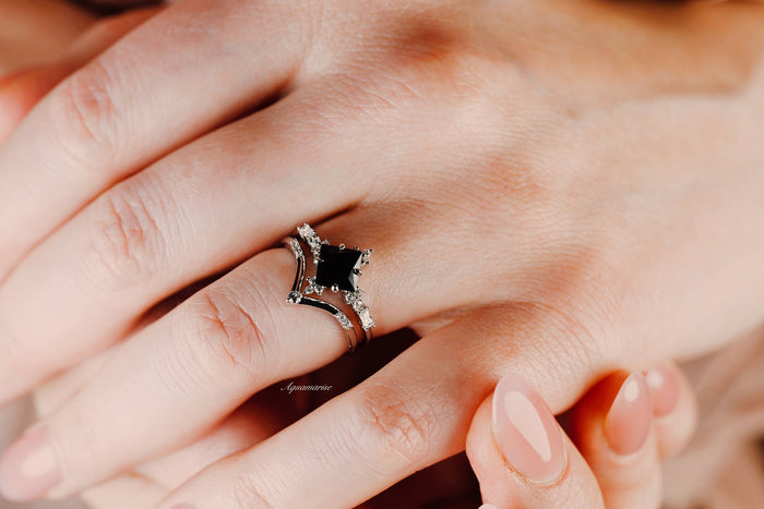Black Onyx & Meteorite Couples Ring Set by Aquamarise featuring a black onyx centerpiece with diamond accents and sleek meteorite inlay, symbolizing unity in matching couples rings.