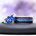 Blue fire opal and sapphire couples ring set — kite sapphire ring beside a silver tungsten opal inlay band