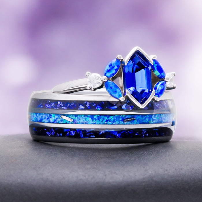 Sapphire engagement ring stacked on the blue fire opal inlay band, showing the marquise opal accents