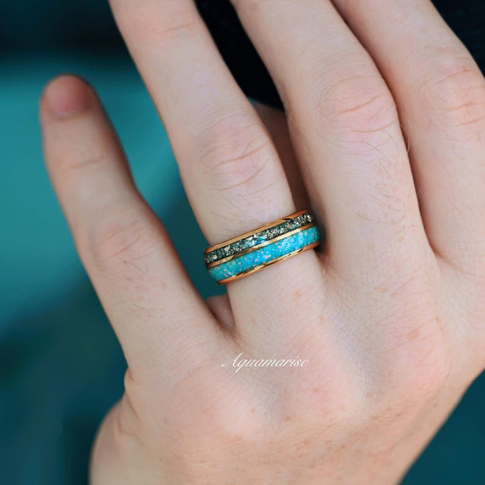 Blue Fire Opal & Crushed Diamond Couples Ring Set featuring a vivid blue fire opal inlay paired with crushed diamond accents on a gold band, styled by Aquamarise from Matching Couples' Rings and April and October Birthstone Jewelry collections.