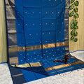 Handloom Maheshwari silk saree in blue, flower buti scattered across the body, with a wide golden zari border