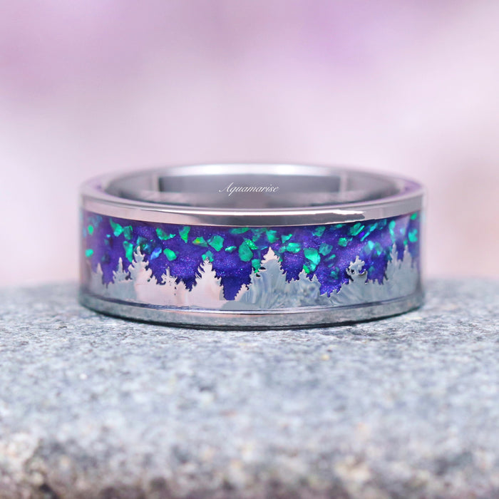 Borealis Forest & Teal Sapphire Couples Ring Set- Northern Lights & Trees featuring a polished band with a glowing teal and purple inlay depicting a detailed forest silhouette, crafted by Aquamarise for Matching Couples' Rings and September Birthstone Jewelry collections.