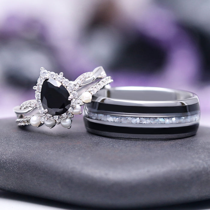 Briar Black Onyx & Pearl Ring Set in Sterling Silver by Aquamarise features a teardrop-shaped black onyx surrounded by small pearls and sparkling stones, paired with a sleek band inset with crushed pearl and black onyx, perfect for unique engagement or promise rings.