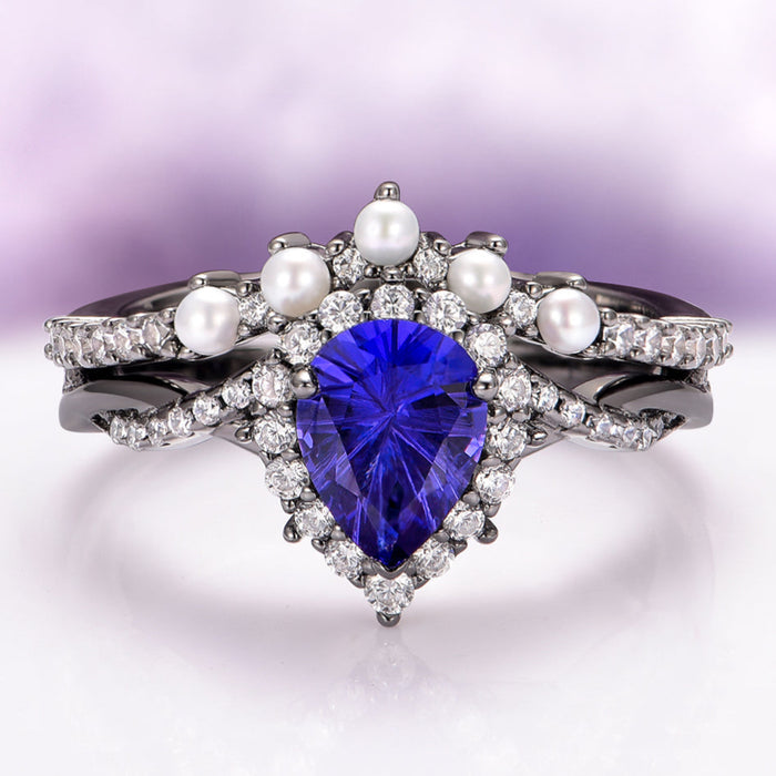 Ring with blue heart-shaped gemstone and pearls on a gradient background