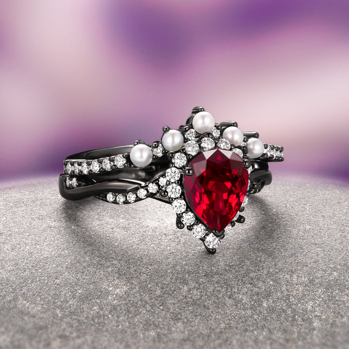 Briar Natural Red Garnet & Pearl Ring Set in Black Ruthenium featuring a pear-shaped garnet, pearls, and sparkling accents by Aquamarise, elegant and unique engagement jewelry.