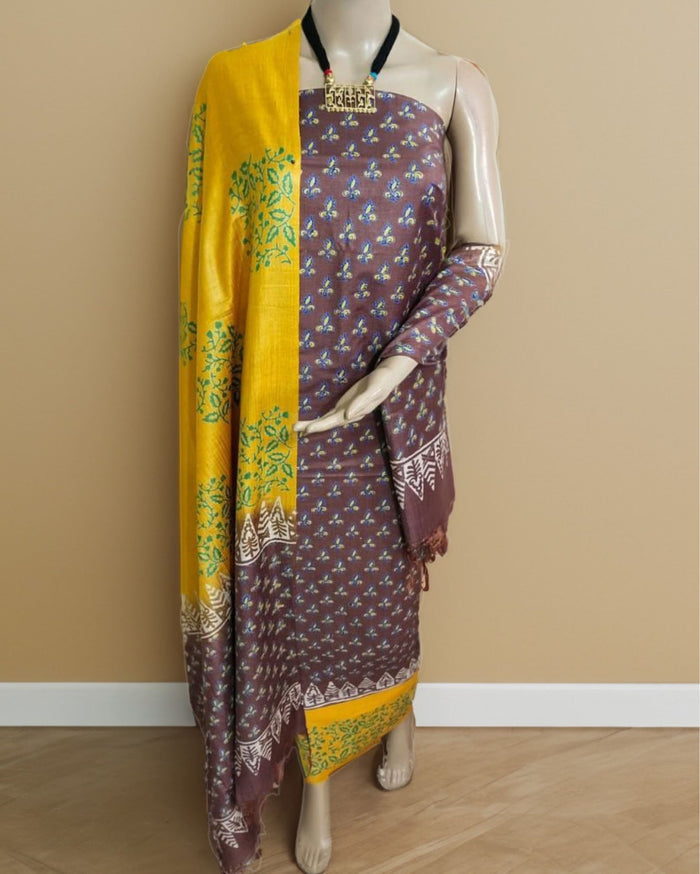 Brown and yellow panelled katan silk unstitched suit set with hand block printed floral sprigs, leaf vines and a triangular geometric border