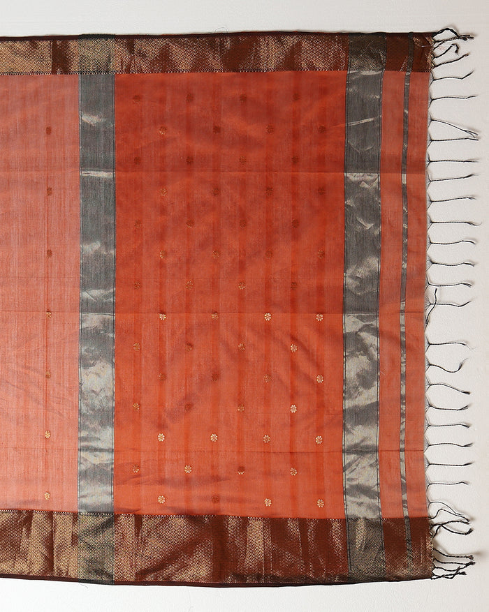 Handloom Maheshwari silk saree in burnt orange, flower buti scattered across the body, with a wide golden zari border