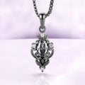 Carmilla gray moissanite pendant necklace in black ruthenium, oval center with a black onyx pear on a box chain