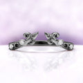 Carmilla ring enhancer in black ruthenium, an open leaf and vine wrap set with moissanite