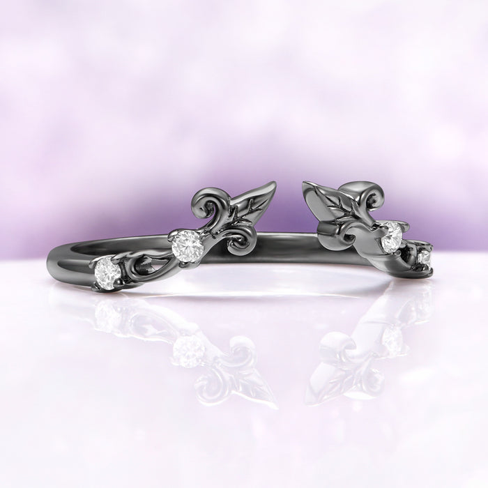 Angled view of the black ruthenium Carmilla ring enhancer showing the open front and carved leaf terminals