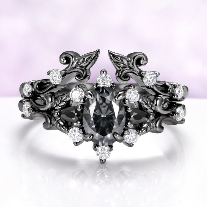 The black ruthenium Carmilla ring enhancer wrapped around a matching gray moissanite engagement ring