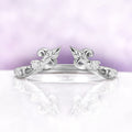 Carmilla ring enhancer in sterling silver, an open leaf and vine wrap set with moissanite