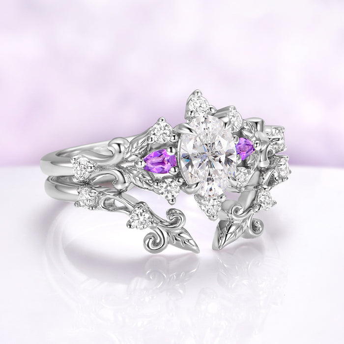Angled view of the Carmilla sterling silver enhancer worn together with an engagement ring on one finger