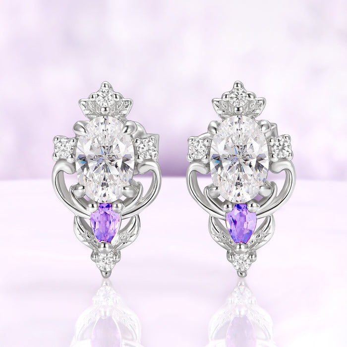 Carmilla moissanite stud earrings in sterling silver, oval centers with natural amethyst pears and carved leaf and scroll frames