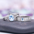 Celtic Aquamarine Couples Ring Set by Aquamarise featuring an oval aquamarine center stone with diamond accents on an intricately designed silver band paired with a textured silver ring with a rectangular aquamarine, part of Matching Couples' Rings and March Birthstone Jewelry collections.