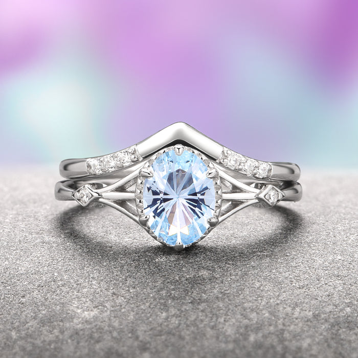 Celtic Aquamarine Couples Ring Set by Aquamarise features a delicate sterling silver design with a sparkling aquamarine centerpiece accented by small diamonds, part of Matching Couples' Rings and March Birthstone Jewelry collections.