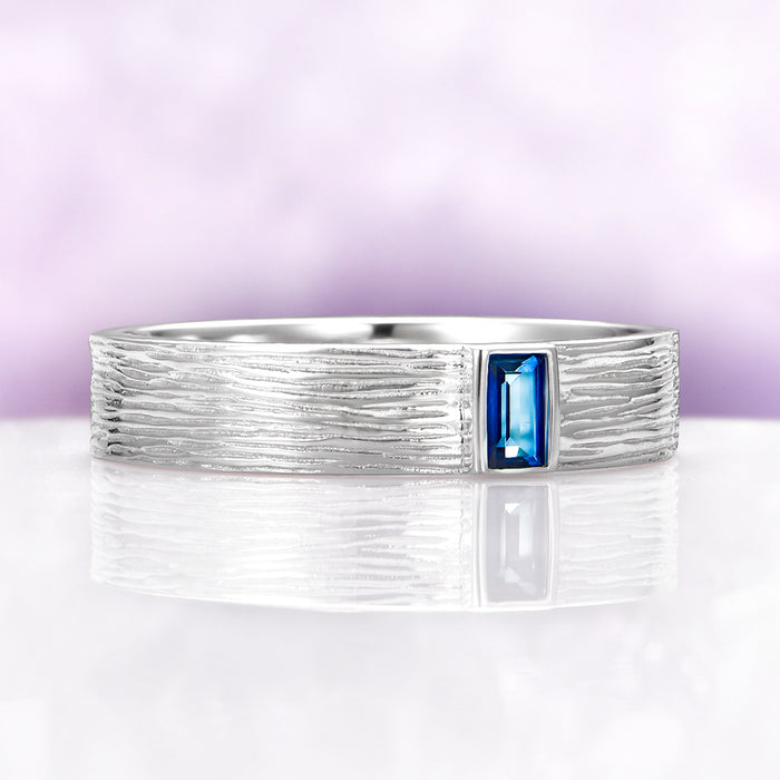 Celtic Natural London Blue Topaz Couples Ring Set by Aquamarise, featuring a textured sterling silver band with a rectangular London Blue Topaz gemstone, part of Matching Couples' Rings collection.