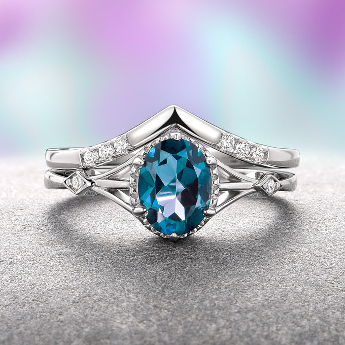 Celtic Natural London Blue Topaz Couples Ring Set by Aquamarise features an oval London Blue Topaz gemstone set in sterling silver with intricate Celtic-inspired detailing and small diamond accents, part of Matching Couples' Rings and November Birthstone collections.