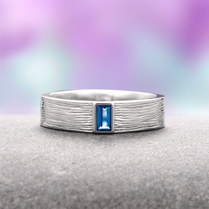Celtic Natural London Blue Topaz Couples Ring Set by Aquamarise features a textured sterling silver band with a rectangular London Blue Topaz stone, part of Matching Couples' Rings, November Birthstone, and Artisan Couples Rings collections.