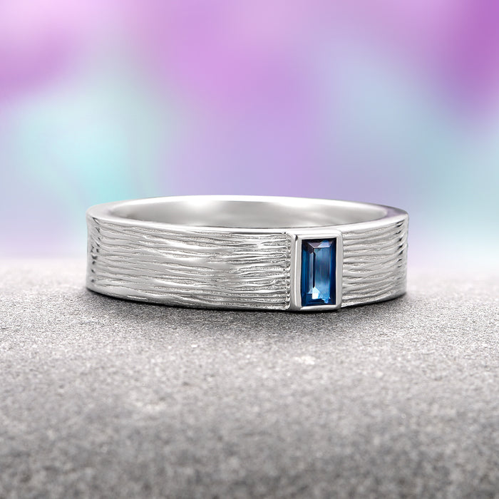 Celtic Natural London Blue Topaz Couples Ring Set by Aquamarise features a textured sterling silver band with a rectangular London Blue Topaz stone, part of Matching Couples' Rings, November Birthstone, and Artisan Couples Rings collections.