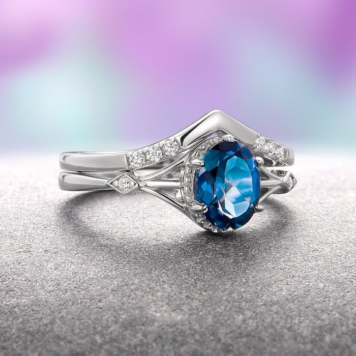 Celtic London Blue Topaz Ring Set- 14K White Gold by Aquamarise Gold, featuring a deep oval London blue topaz centerpiece accented with small diamonds on a finely crafted white gold band, part of Solid Gold Engagement Rings and November Birthstone collections.