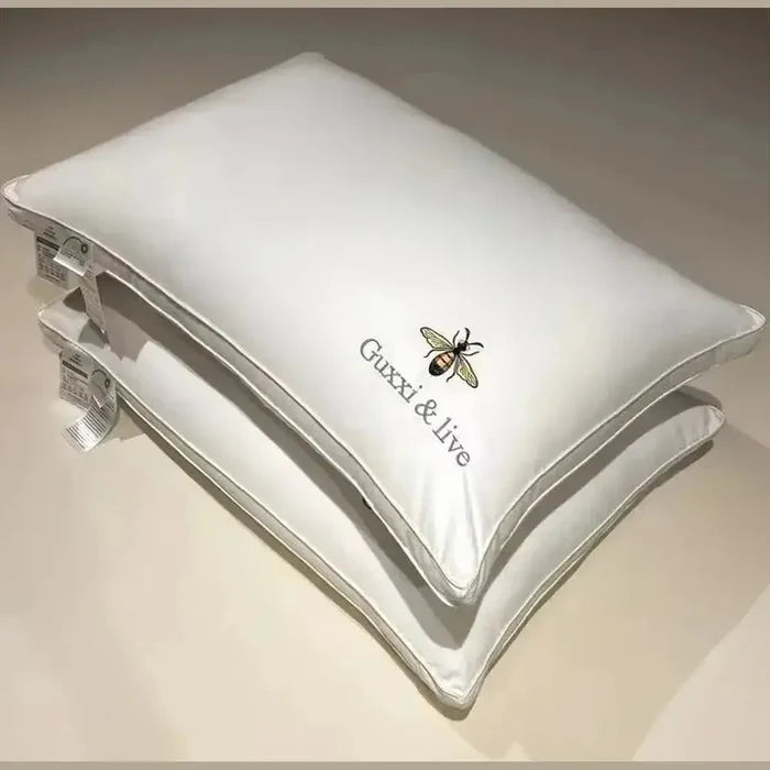 Cervical massage pillow featuring soft fabric and unique bee design for ergonomic neck support.