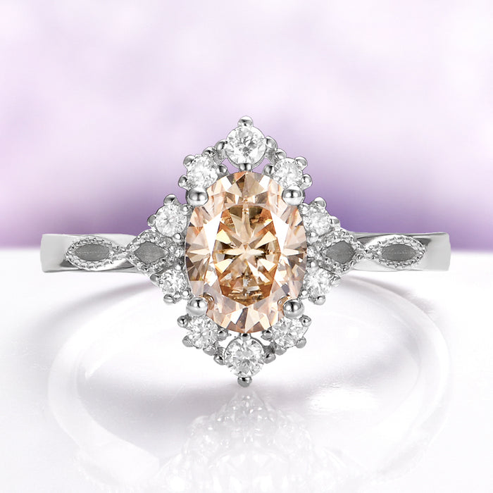 Champagne Moissanite Vintage Engagement Ring in 14K White Gold by Aquamarise Gold, showcasing an oval champagne moissanite center with a diamond halo and detailed vintage-inspired band design.