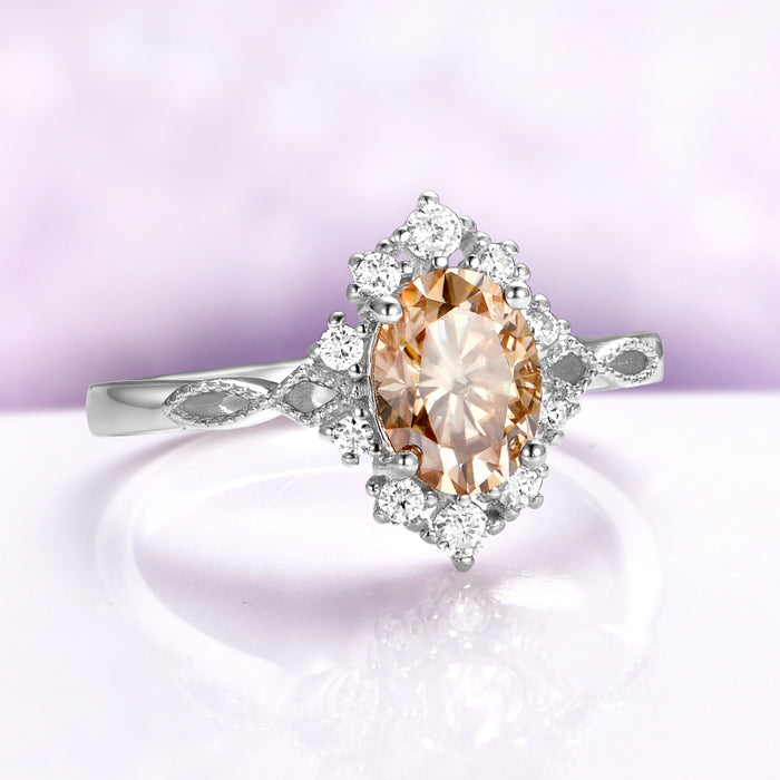 Champagne Moissanite Vintage Engagement Ring in 14K White Gold by Aquamarise Gold, featuring an oval champagne moissanite center with diamond halo and vintage inspired band design.