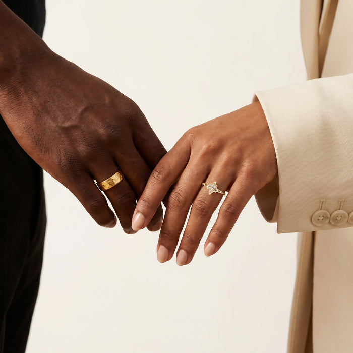 Champagne Moissanite Lotus Couples Ring Set by Aquamarise, featuring a marquise champagne moissanite with lotus-inspired details and a hammered gold band for matching couple rings.