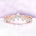 Chevron Curved Wedding Band in 14K Rose Gold Vermeil by Aquamarise, featuring a marquise center stone with round brilliant accent diamonds on a curved rose gold band.