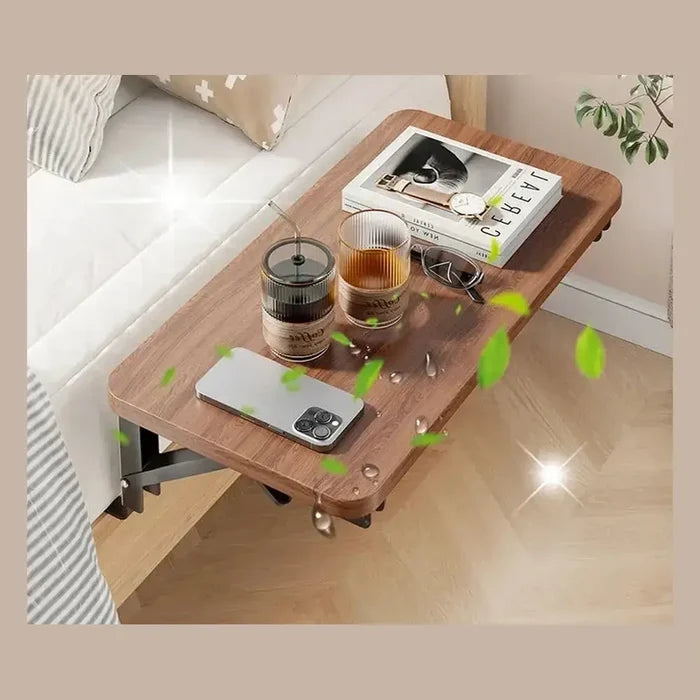 clip-on bedside shelf organizer holding drinks and phone next to bed