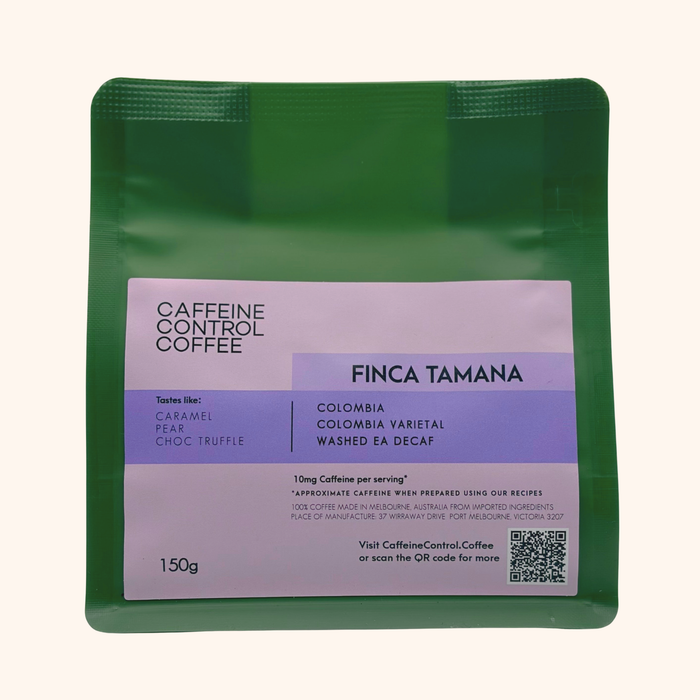 Green coffee package with purple label featuring 'Caffeine Control Coffee' branding.