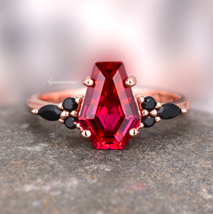 Coffin Cut Ruby and Rose Gold Leaf Couples Ring Set featuring a vibrant ruby center stone with black diamond accents on elegant rose gold band by Aquamarise.