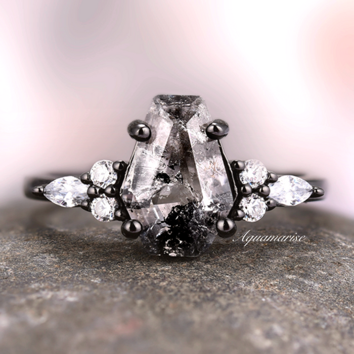Close-up of the coffin cut Herkimer diamond and side stones set in black ruthenium