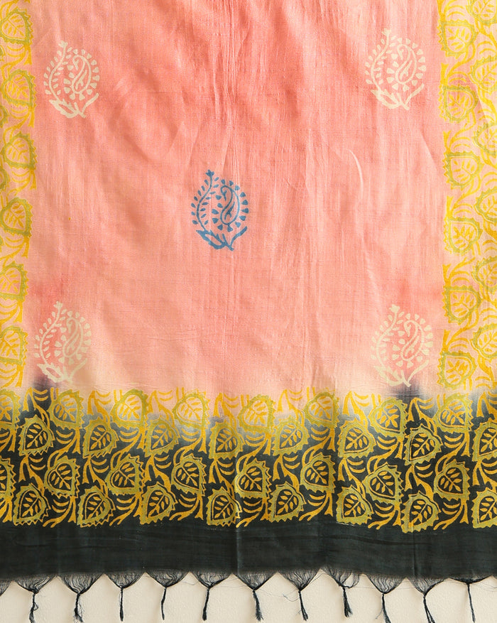 Unstitched Katan silk suit set with a soft coral pink fabric printed in small metallic dash motifs and a contrasting black piece with dense floral vine block print and a wide ornate multi-layered fringed border.
