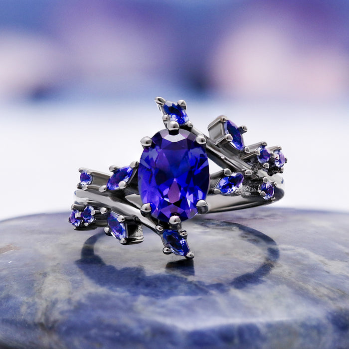 Cornflower Blue Sapphire Leaf Engagement Ring in Black Ruthenium – shown on hand