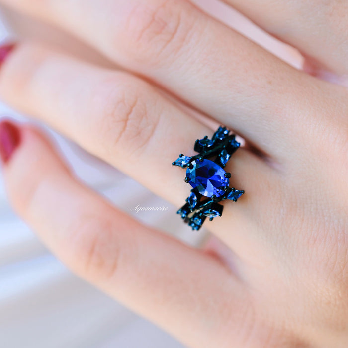 Cornflower Sapphire & Orion Nebula™ Couples Ring Set by Aquamarise, featuring a deep blue sapphire set in a black band with celestial and galaxy-inspired design for matching couples rings.