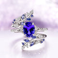Orion Nebula™ & Cornflower Sapphire Leaf Couples Ring Set by Aquamarise featuring an elegant silver band adorned with a vibrant cornflower sapphire center stone and delicate leaf-inspired accents with small blue sapphires and diamonds, part of Matching Couples' Rings, September Birthstone Jewelry, Leaf Rings, and Orion Nebula Rings® collections.