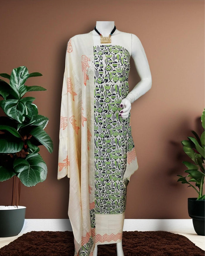 Cream and white Katan silk unstitched suit set hand block printed with a small all-over fish motif in green, black and peach, sparse fish motifs on the dupatta and a zigzag border at the hem.