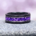 Crushed Amethyst Wedding Band- 8MM Black Tungsten featuring a hammered black tungsten band with a vibrant crushed amethyst inlay, capturing a rich purple shimmer, crafted by Aquamarise from Men’s Wedding Bands and February Birthstone collections.