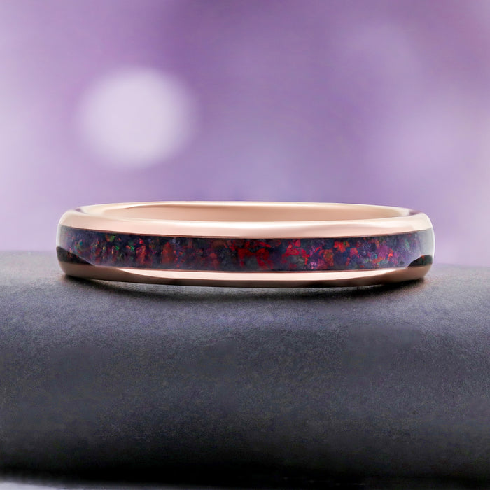 Side profile of the 4mm rose gold tungsten band with black opal inlay