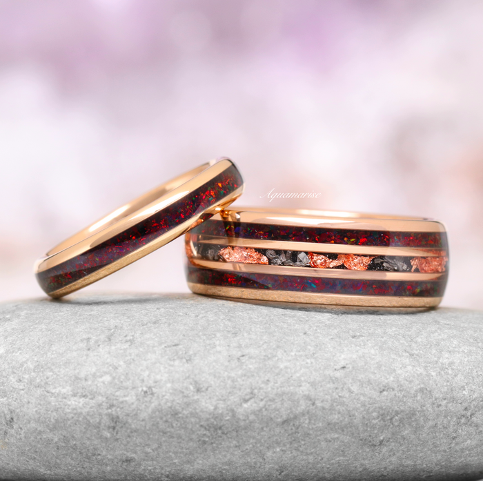 Black Fire Opal & Meteorite Couples Ring Set by Aquamarise featuring rose gold bands with red fire opal, meteorite flakes, and copper accents in a celestial matching design.