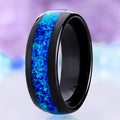 Crushed blue opal men's wedding band in polished black tungsten, 8mm dome with a wide lab-created opal channel