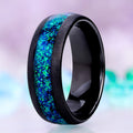 Crushed peacock opal men's wedding band in sandblasted black tungsten, 8mm dome with a wide lab-created blue-green opal channel