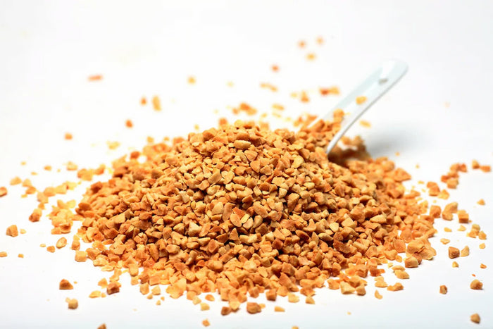 Pile of crushed peanuts on a white background photo from Nutworks