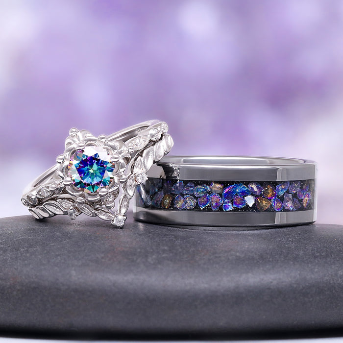 Two rings with gemstones on a dark surface and purple gradient background