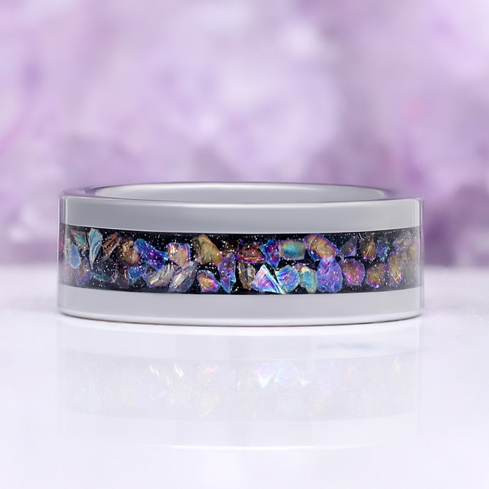 Crushed Rainbow Men's Wedding Band in Black Tungsten Carbide (8mm) by Aquamarise, showing the full rainbow opal inlay channel.