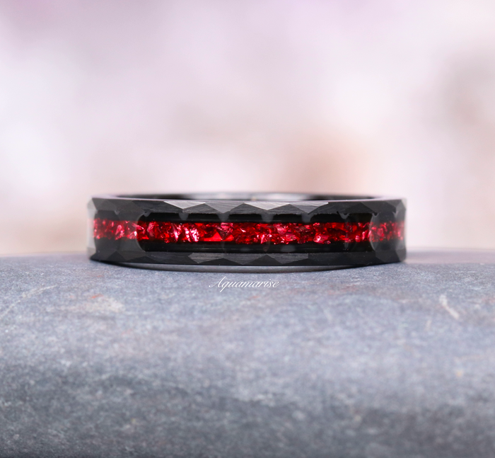 Crushed Red Garnet Couples Ring Set by Aquamarise featuring a faceted black tungsten band with vibrant crushed red garnet inlay, symbolizing passion in matching couples rings.